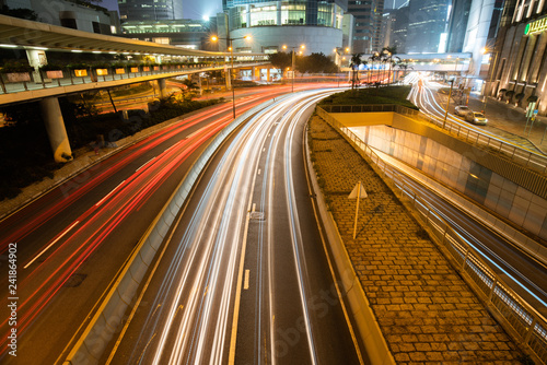 Car traffic light trail on city road