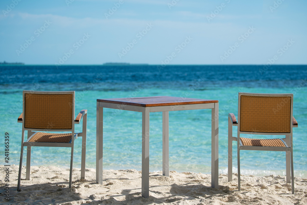 Table outdoor next to sea scenic.