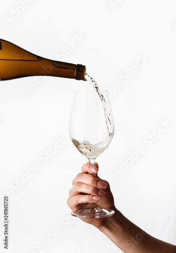 poured white wine in a glass