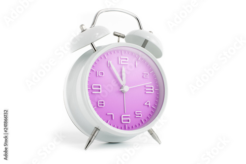 Table alarm clock with time 5 to 12 with pink clock face, 11.55 AM PM, on white background