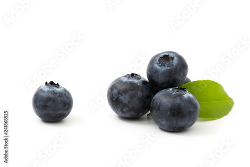 Group blueberries and leaf isolated on white