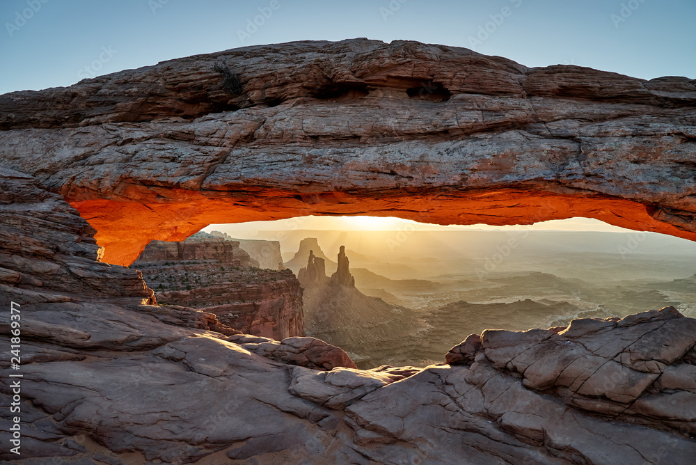 sunrise behind Mesa Arch in Canyonlands National Park, Island in the Sky , Moab, Utah, USA, North America