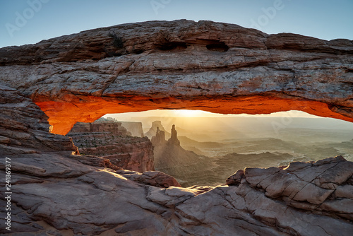 sunrise behind Mesa Arch in Canyonlands National Park, Island in the Sky , Moab, Utah, USA, North America