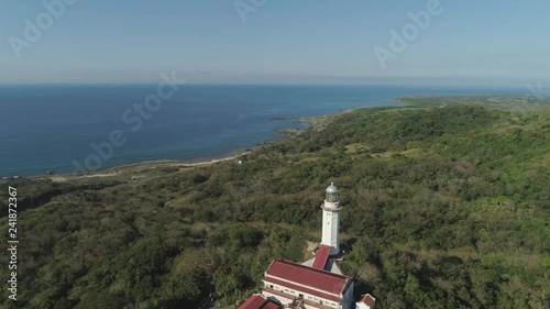 Aerial view lighthouse on hill and sea. Cape Bojeador Lighthouse, Burgos, Pagudpud, Ilocos Norte, Philippines photo