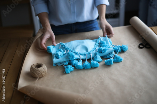 handmade dress in paper packaging,girl wraps dress
