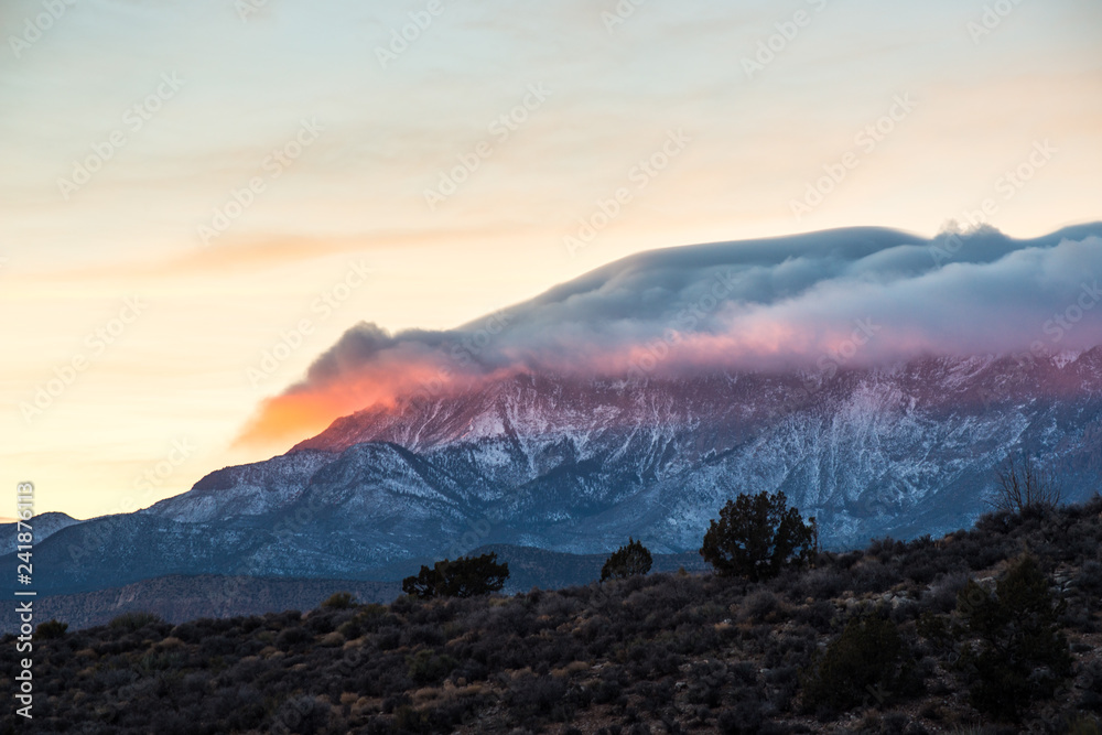 Sunlit cloud blankets Pine Valley Mountain at sunset, UT