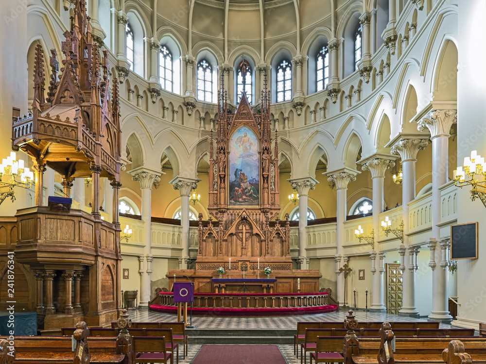 Obraz premium Choir and altar of St. John's Church (Johanneksenkirkko) in Helsinki, Finland. The church was built in 1888-1891 by design of the Swedish architect Adolf Emil Melander.