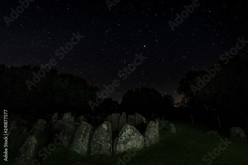 Dolmen of the Great Oak. Night landscape with ancient prehistoric dolmen. Montehermoso. Extremadura. Spain. photo