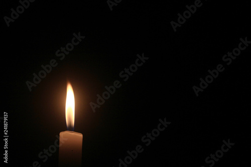 light from candle in the dark.