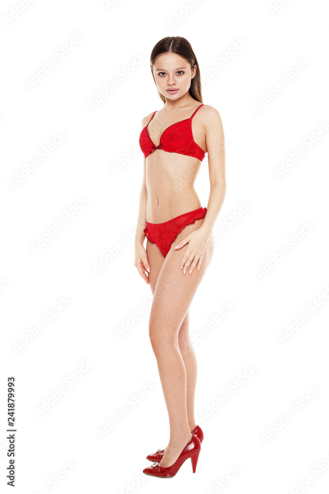 Beautiful young girl in red underwear isolated on white background Stock  Photo | Adobe Stock