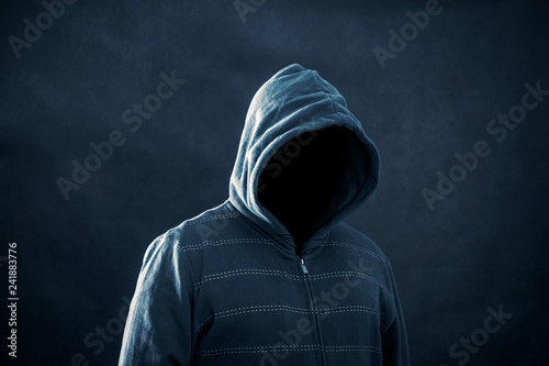 Hooded man in the dark 