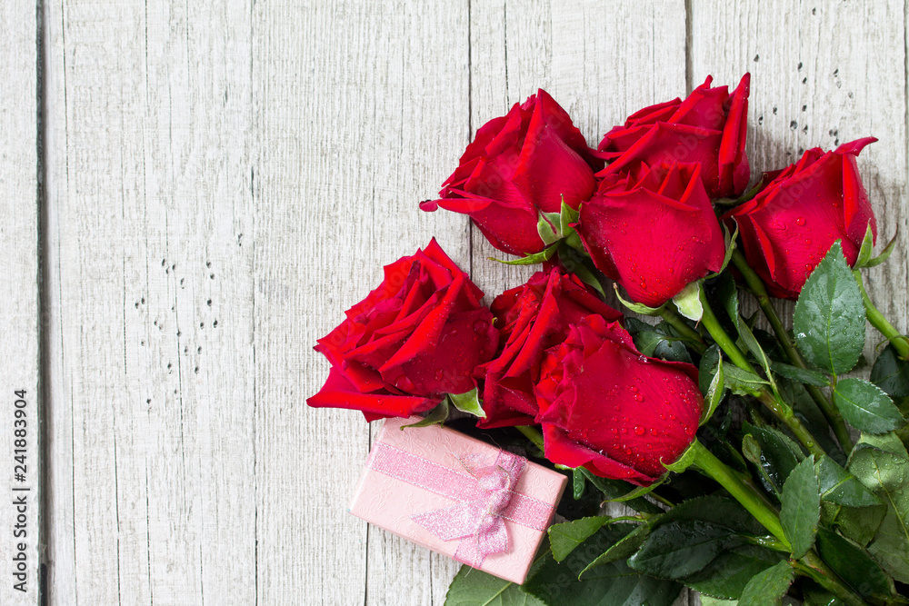 Wedding or Valentines Day, Mother day card. Beautiful blooming Red roses  and gift box on wooden board. Top view flat lay background. Copy space.  Stock Photo | Adobe Stock