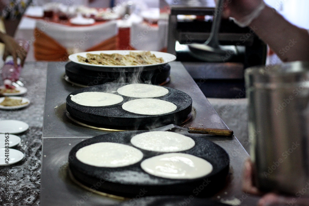baking pancakes, the chef prepares, Breakfast at the restaurant baking pancakes, the chef prepares, Breakfast at the restaurant