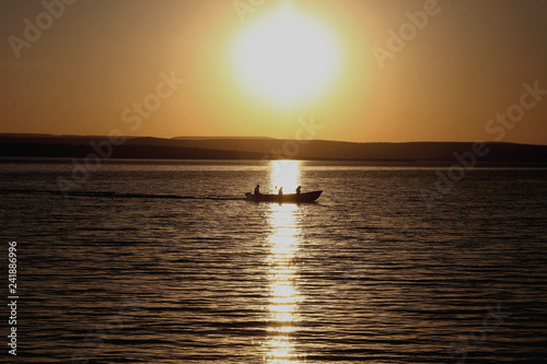 sunset on the lake Fishermen Twilight signals Coconut tree at sunset Beach showers © sergiomourao