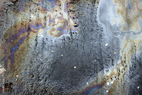 Oil spill wet asphalt pavement texture surface