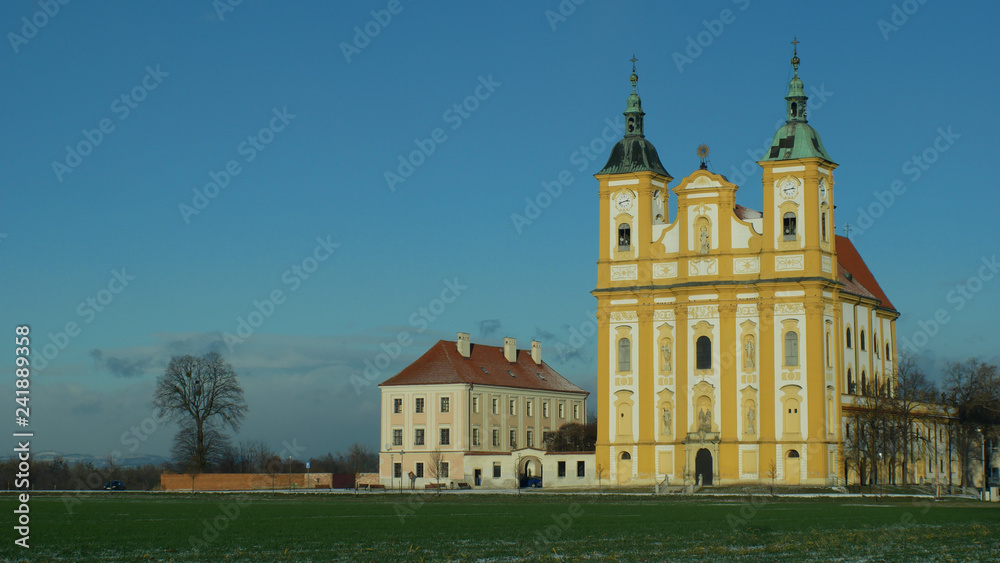 Pilgrimage church Ocistovani Panny Marie in winter tree, in the Dub nad Moravou, a baroque church in a field in the agricultural landscape, blue sky, Central Moravia, Czech Republic, Europe