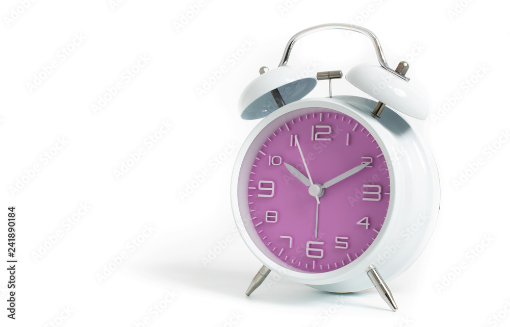 Narrow focus to clock with time 10 past 12 or 10.00 AM PM, violet clock face, on white background Narrow focus to clock with time 10 past 12 or 10.00 AM PM, violet clock face, on white background