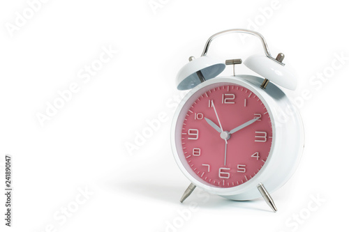 Narrow focus to clock with time 10 past 12 or 10.00 AM PM, pink clock face, on white background