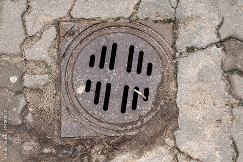 Rain well in the parking lot. Rain drain installation. photo