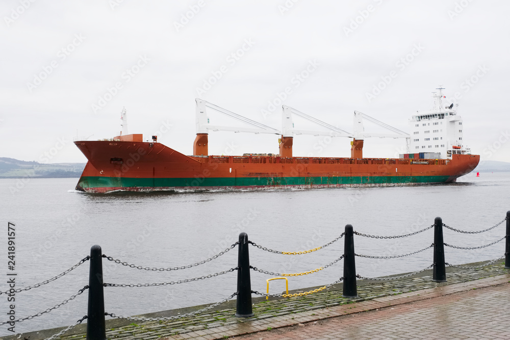 Fototapeta premium Cargo ship vessel freight containers carrier transport on sea ocean to port dock