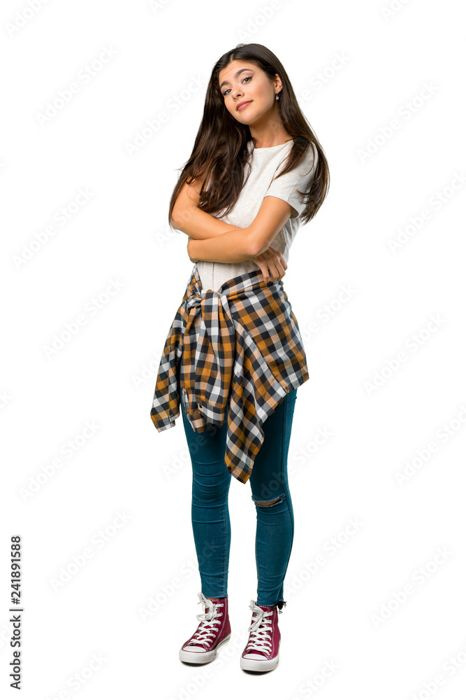 A full-length shot of a Teenager girl with shirt tied to the waist making doubts gesture while lifting the shoulders A full-length shot of a Teenager girl with shirt tied to the waist making doubts gesture while lifting the shoulders