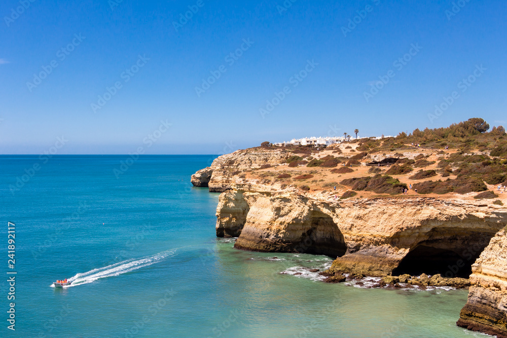 Beautiful view over cliffs and turquoise ocean in Benagil beach (Praia de Benagil), Algarve, Portugal