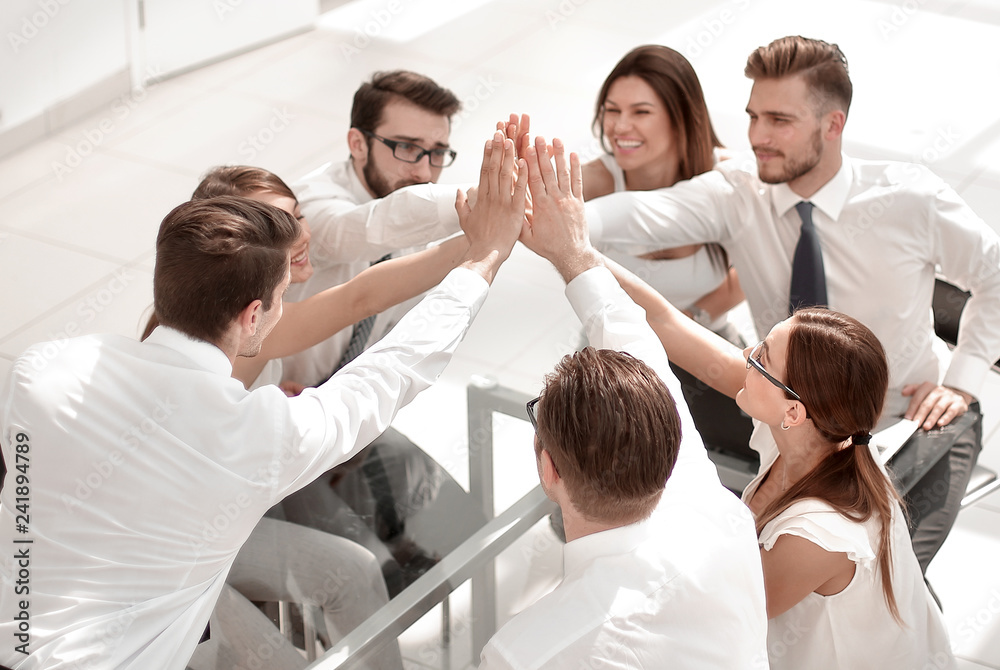 Fototapeta premium successful business team giving each other a high five