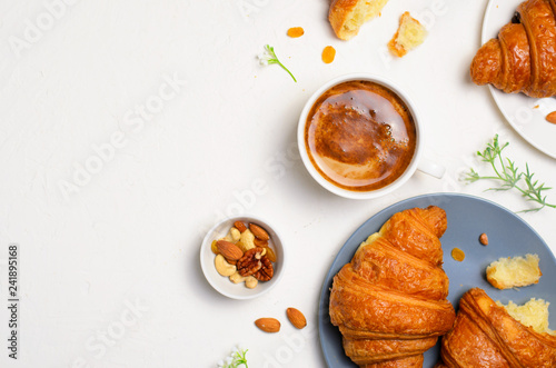 Freshly Baked Croissants and Coffee Cup on White Background