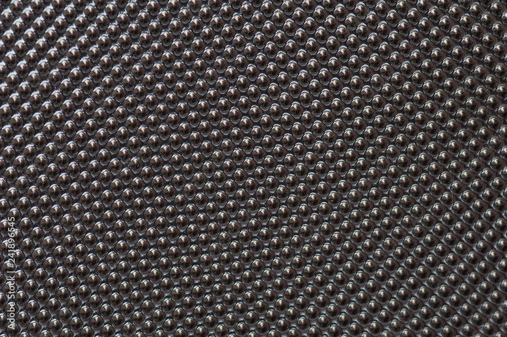 Plastic metalic dot pattern in grey colour. Abstract background of lots of grey pimples dots.