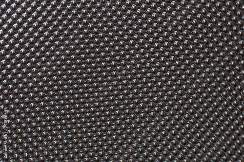 Plastic metalic dot pattern in grey colour. Abstract background of lots of grey pimples dots.