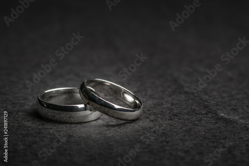 Silver Wedding Rings on a rock background photo