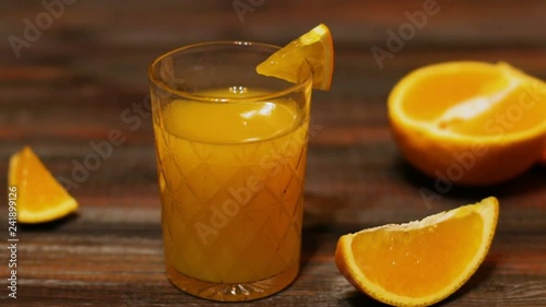 Fresh organic orange juice. Homemade citrus orange juice in glasses on table.