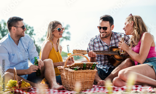 Group of friends having fun on the beach. Lifestyle, vacation concept