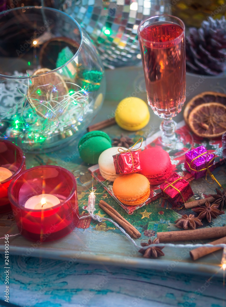 Christmas still life with glass of wine and macaroons