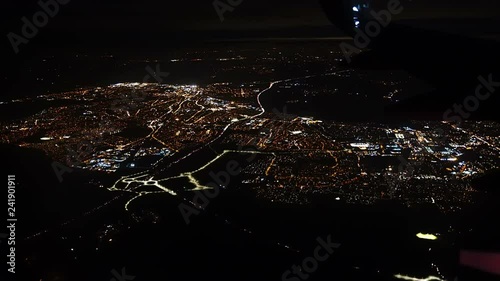4K footage arial view of flying airlpane through the night light city scene London
