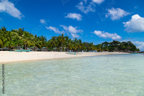 Fototapeta Naklejka Na Ścianę i Meble -  Amazing tropical beach on the island Malcapuya. Beautiful tropical island with white sand and palm trees. Palawan, Philippines.