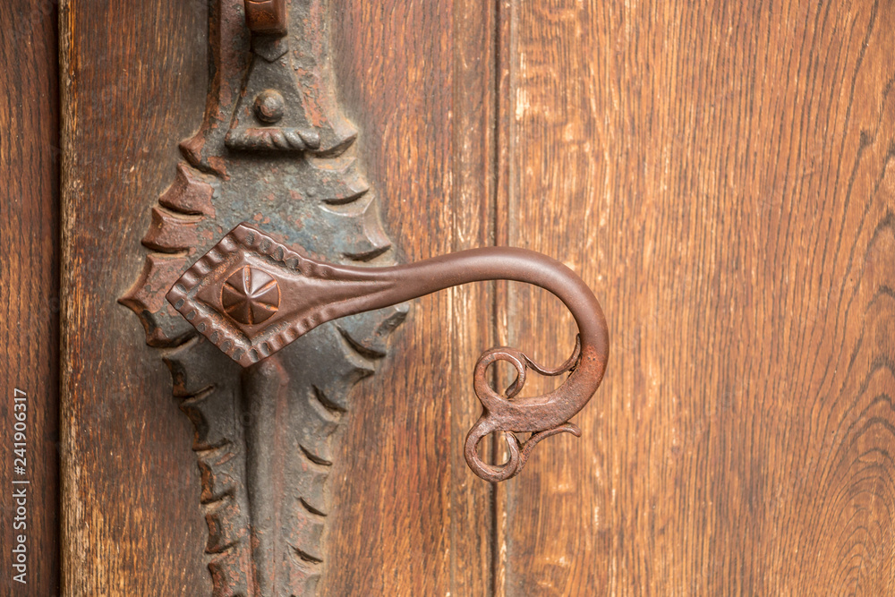 Door handle of an old historical building made of iron Door handle of an old historical building made of iron