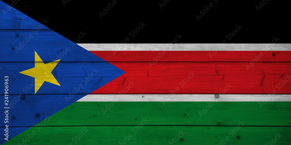 Flag of South Sudan on wooden background, surface. Wooden wall, planks. National flag