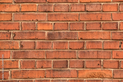 Old empty brick house factory wall with red bricks