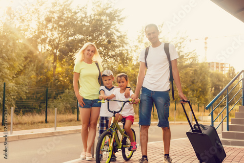 Happy family with suitcases