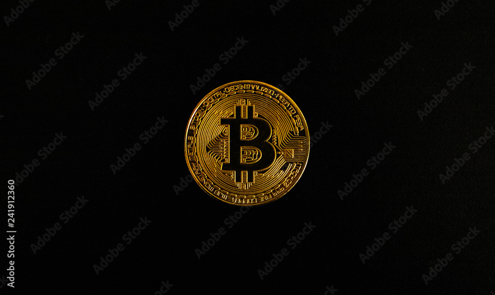 Gold Bitcoin on black background. Isolate. Gold Bitcoin on black background. Isolate.