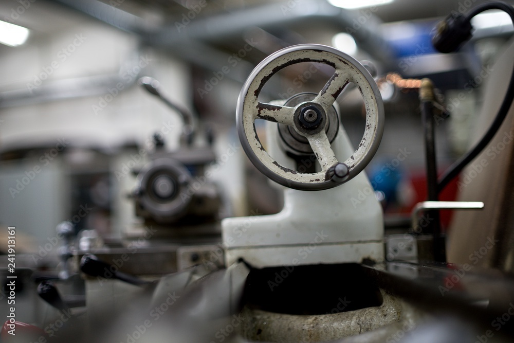 Fototapeta premium Lathe machine for metal cutting, machinery center background.