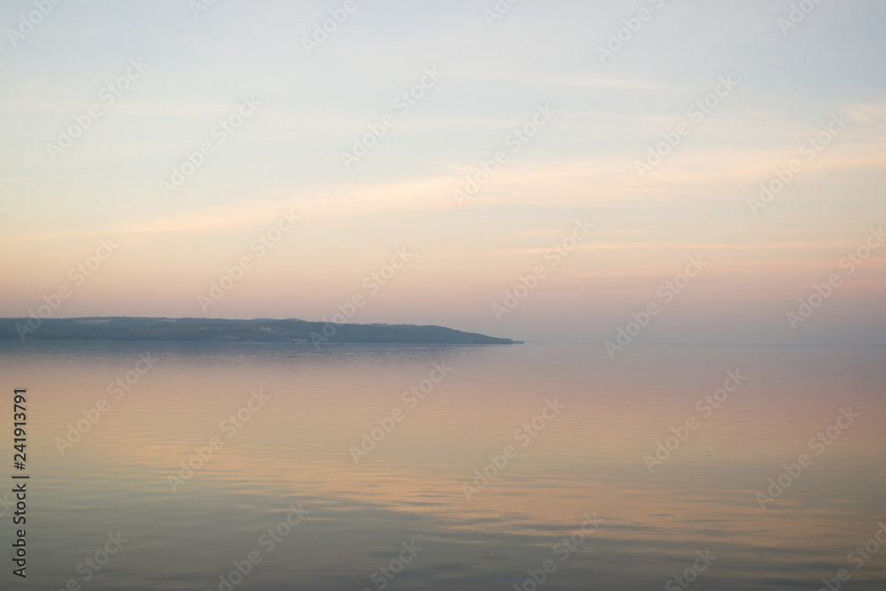 Background of mist on sunset over lake. Composition of nature.