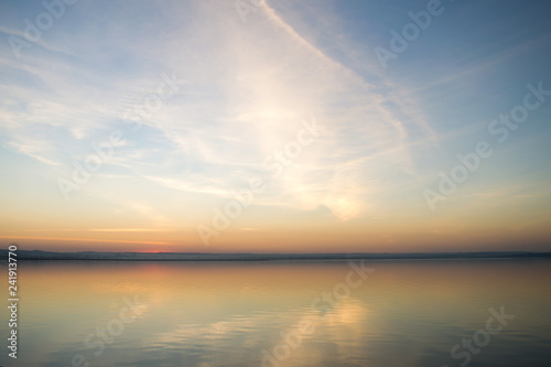 Beautiful red sunset over lake. Composition of nature.