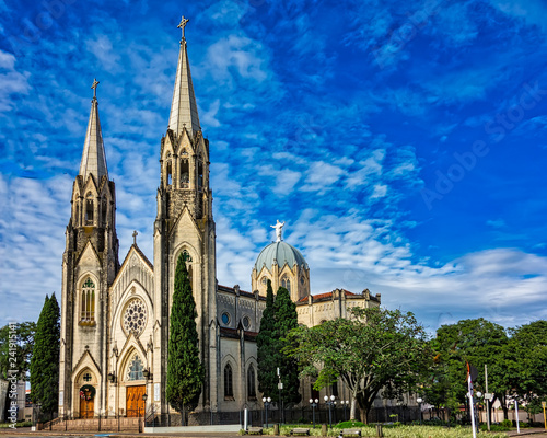 Cathedral church of Botucatu under blue sky with clouds at dawn photo