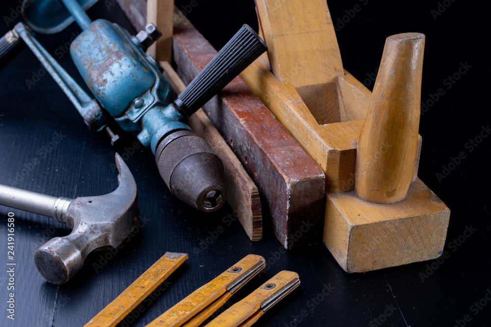 Tools for a carpenter on a workshop table. Accessories for a production worker. Tools for a carpenter on a workshop table. Accessories for a production worker.