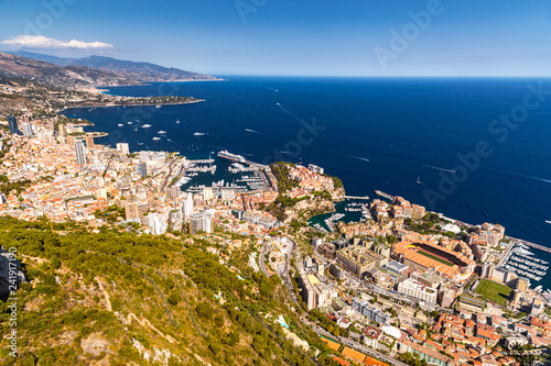Aerial view of Kingdom of Monaco, view from La Turbie, landmark of Monaco, Monte-Carlo, port Hercules, port Fontvieille, Monaco Ville, Palace of Prince, orange color of roofs, Cruise liner, blue sea