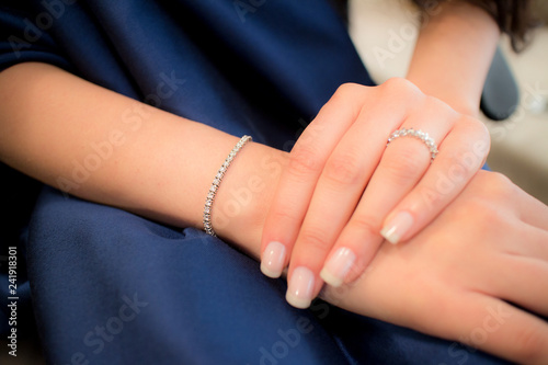 hand with diamong ring and wristlet photo