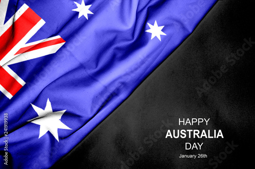 Happy Australia Day - January 26th. Australian flag on dark background.