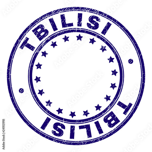 TBILISI stamp seal watermark with grunge texture. Designed with circles and stars. Blue vector rubber print of TBILISI label with dust texture.